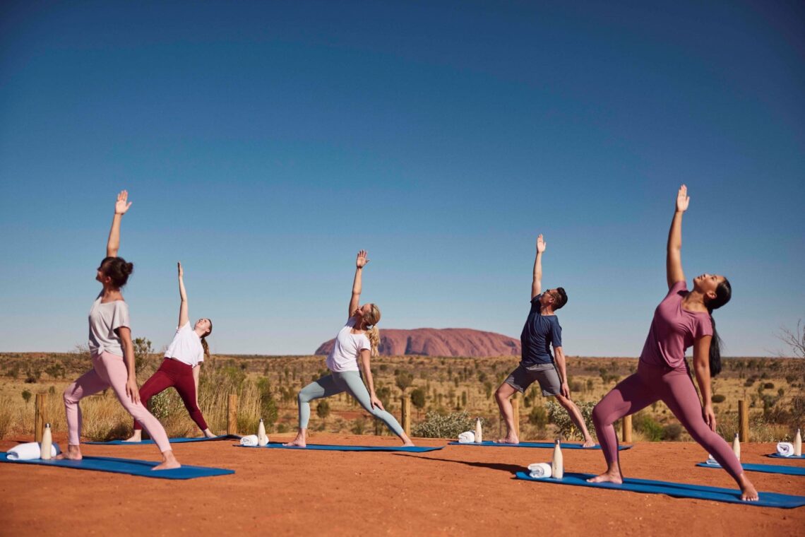 gregor-podgorski | Enjoying a Sunrise Yoga Session with Uluru as Your Backdrop