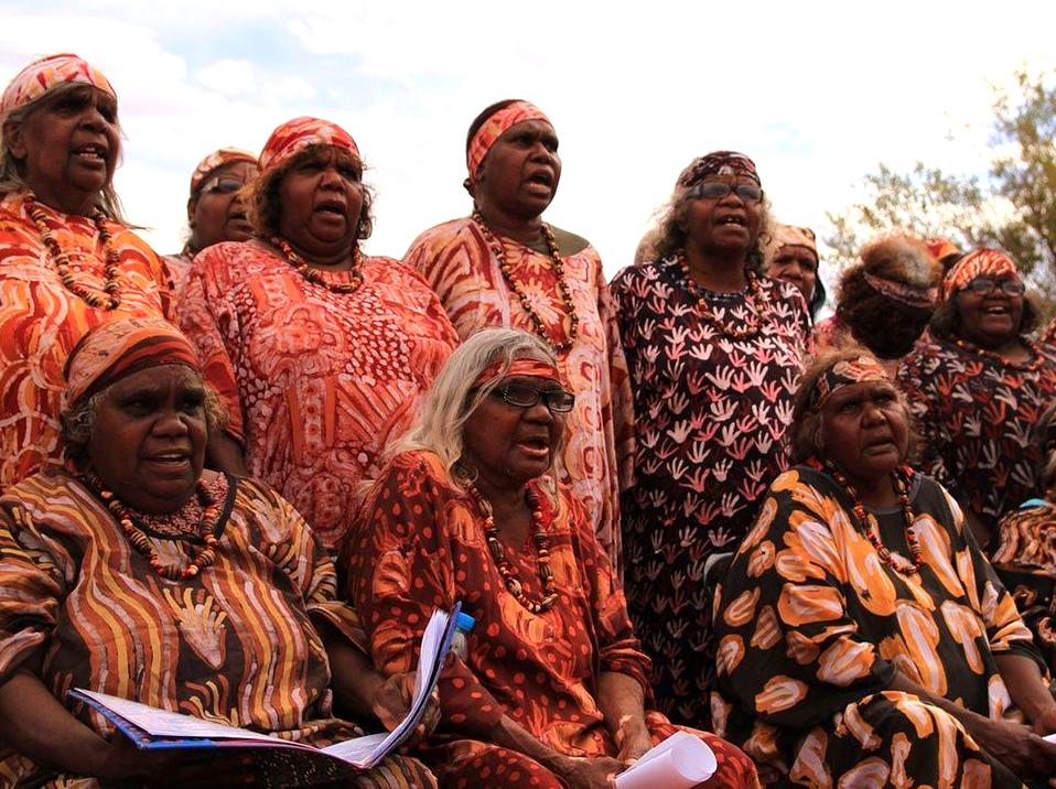 Enjoying an Indigenous Dance Performance